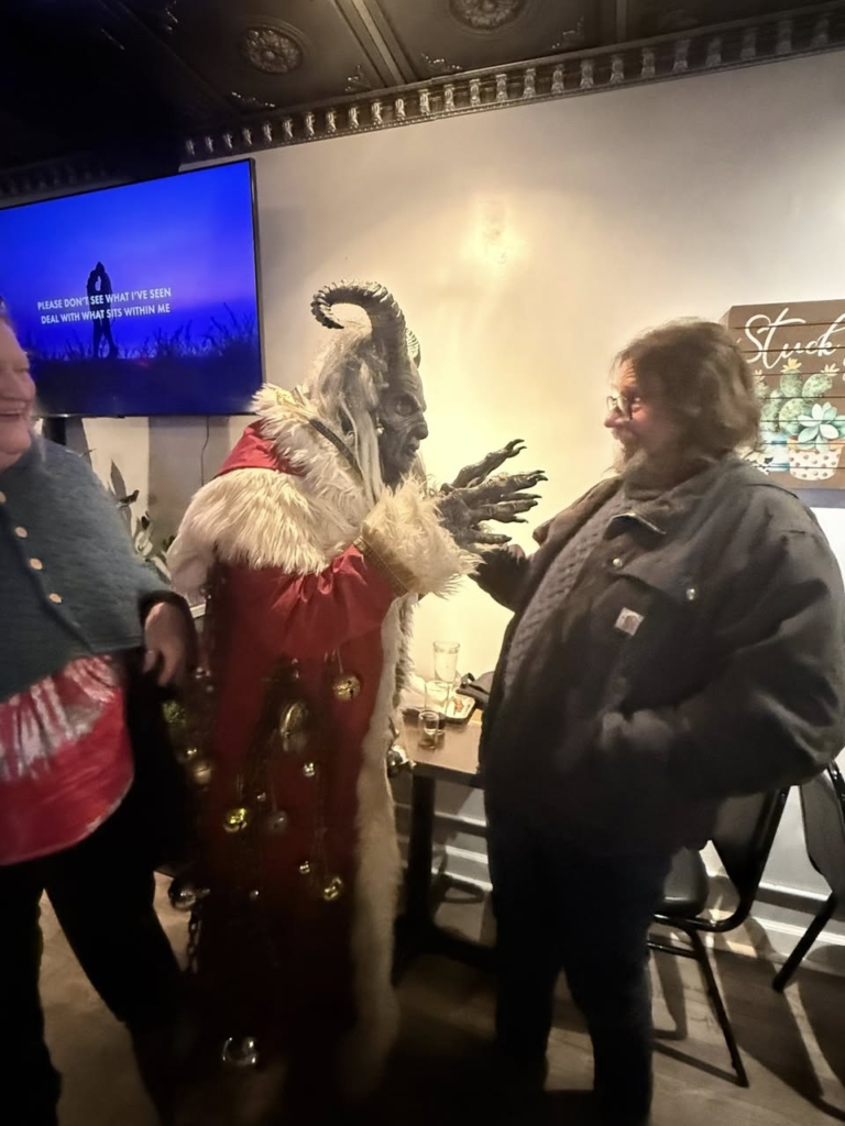 Krampus and Larry with Delight laughing at them. 