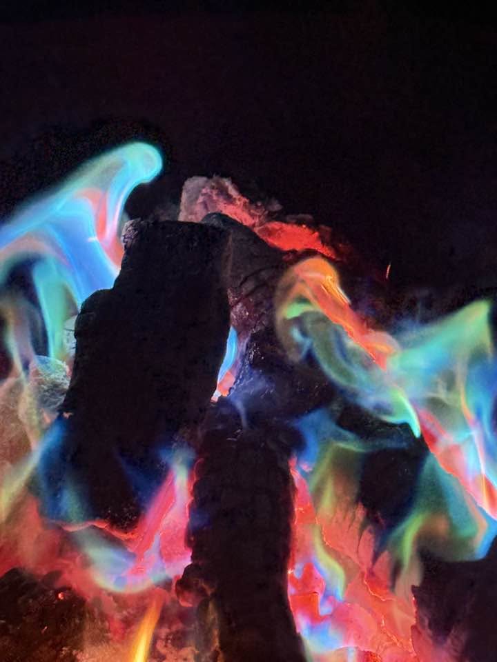 Fire of the year glowing with blue and red flames.